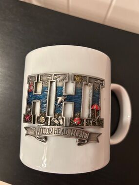 Hilton Head Island (HHI in metal) 
White Ceramic Coffee Mug